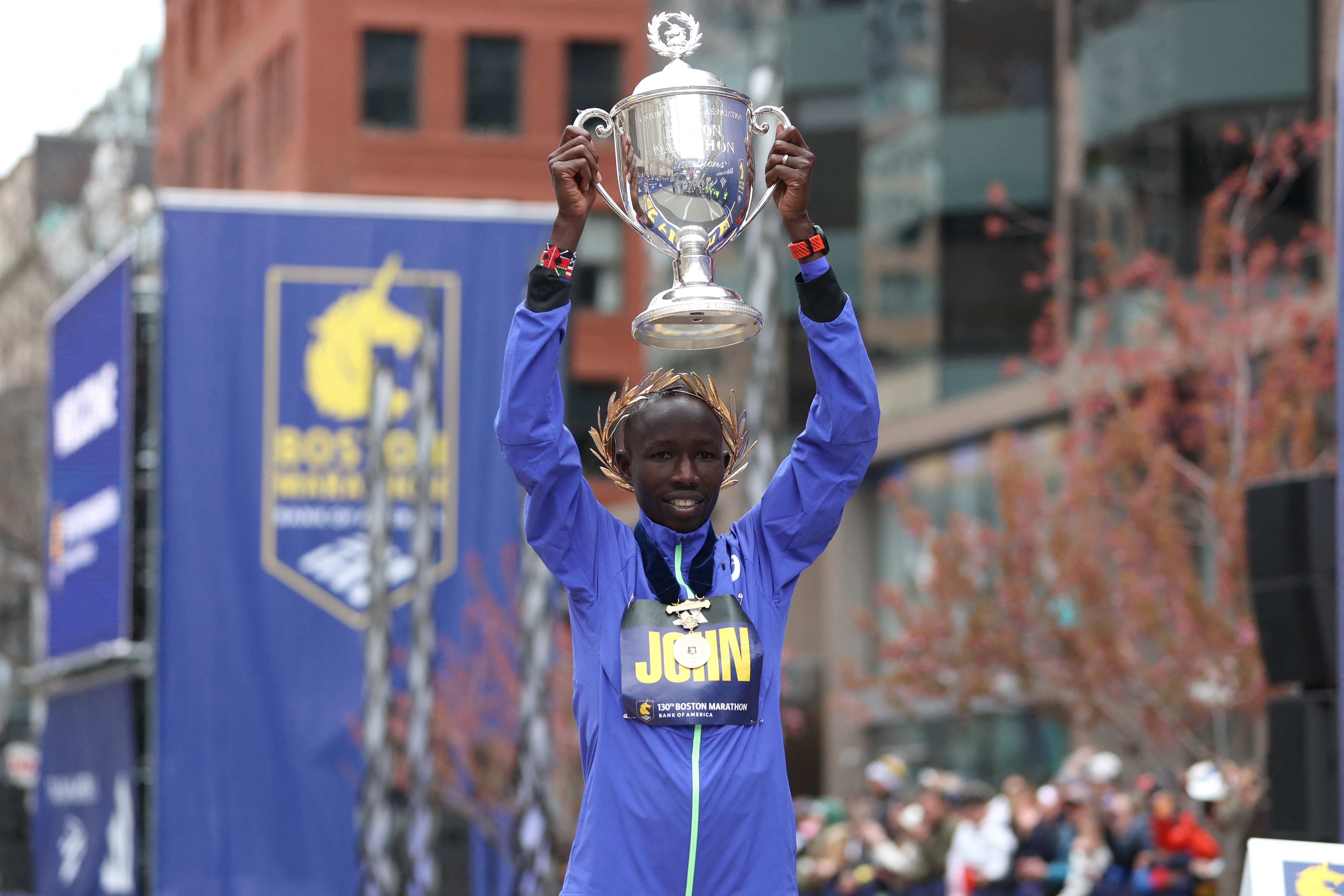 BOSTON, MASSACHUSETTS - APRIL 20: John Korir of Kenya poses with the trophy
