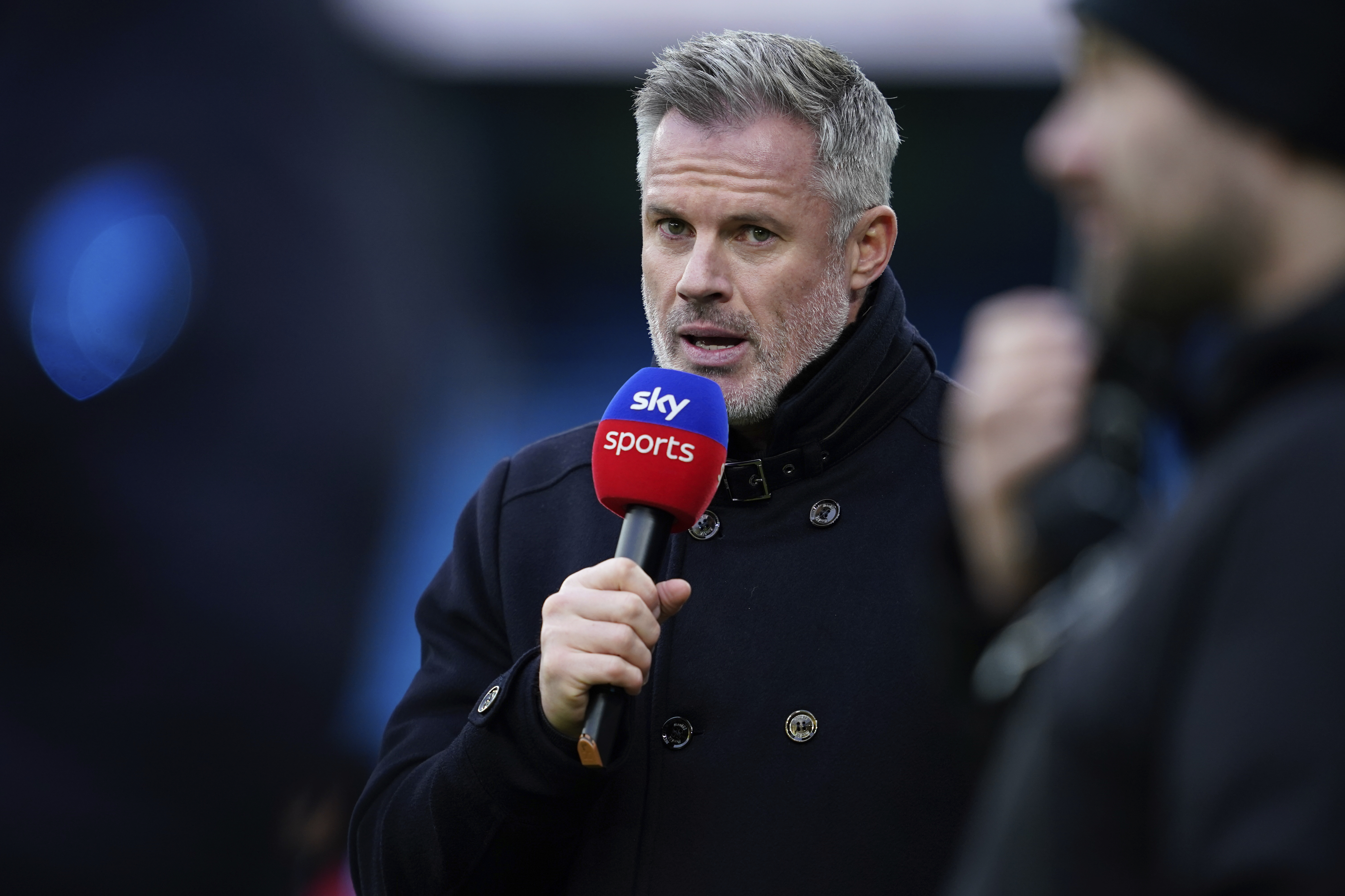 Former Liverpool soccer player, commentator Jamie Carragher speaks prior to the English Premier League soccer match between Manchester City and Liverpool at Etihad stadium in Manchester, England, Sunday, Feb. 23, 2025. (AP Photo/Dave Thompson)