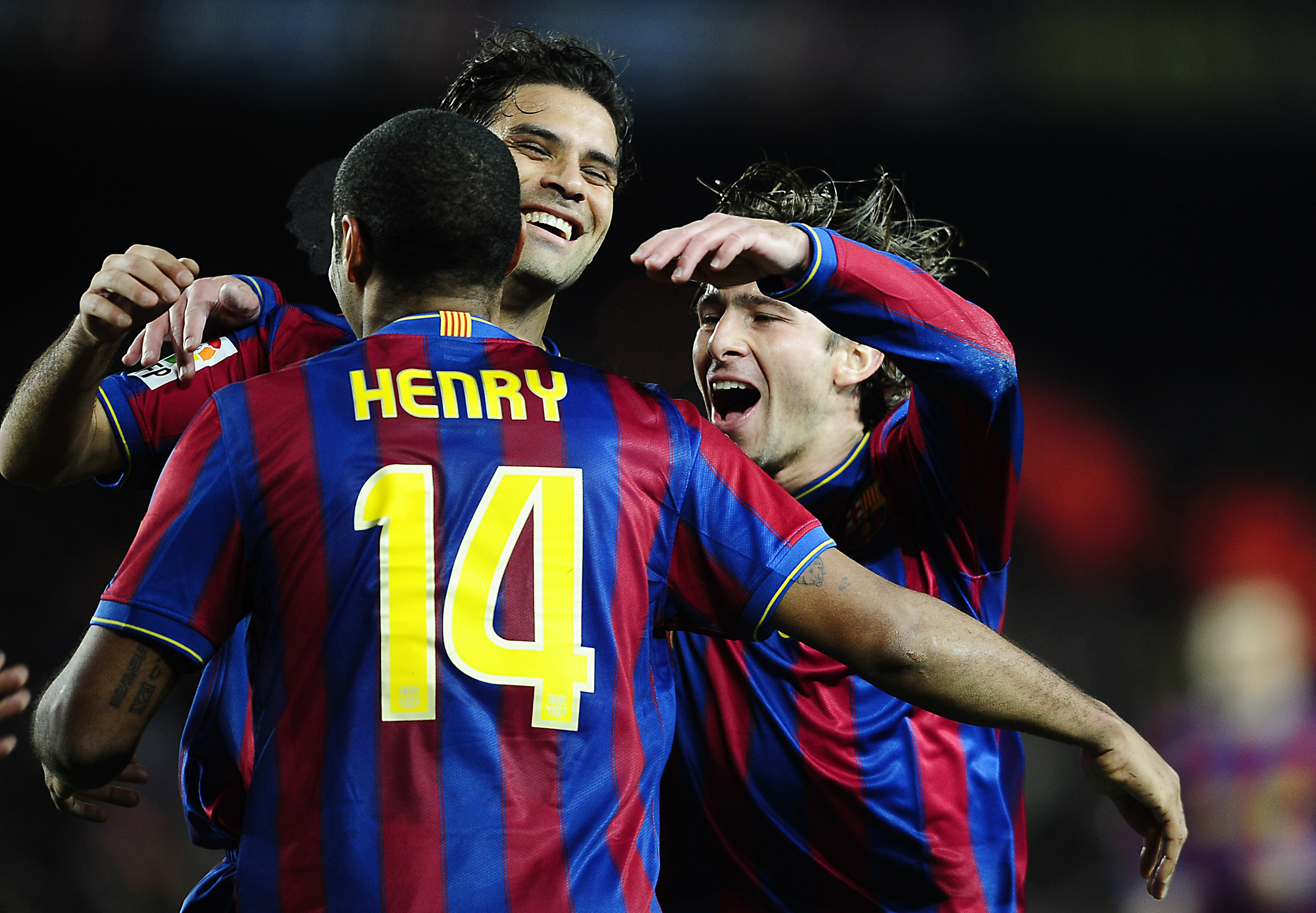 FC Barcelona's Thierry Henry of France, left, reacts with his teammates Maxwell of Brazil, right, and Rafa Marquez of Mexico after scoring against Racing Santander during a Spanish La Liga soccer match at the Camp Nou stadium in Barcelona, Spain, Saturday