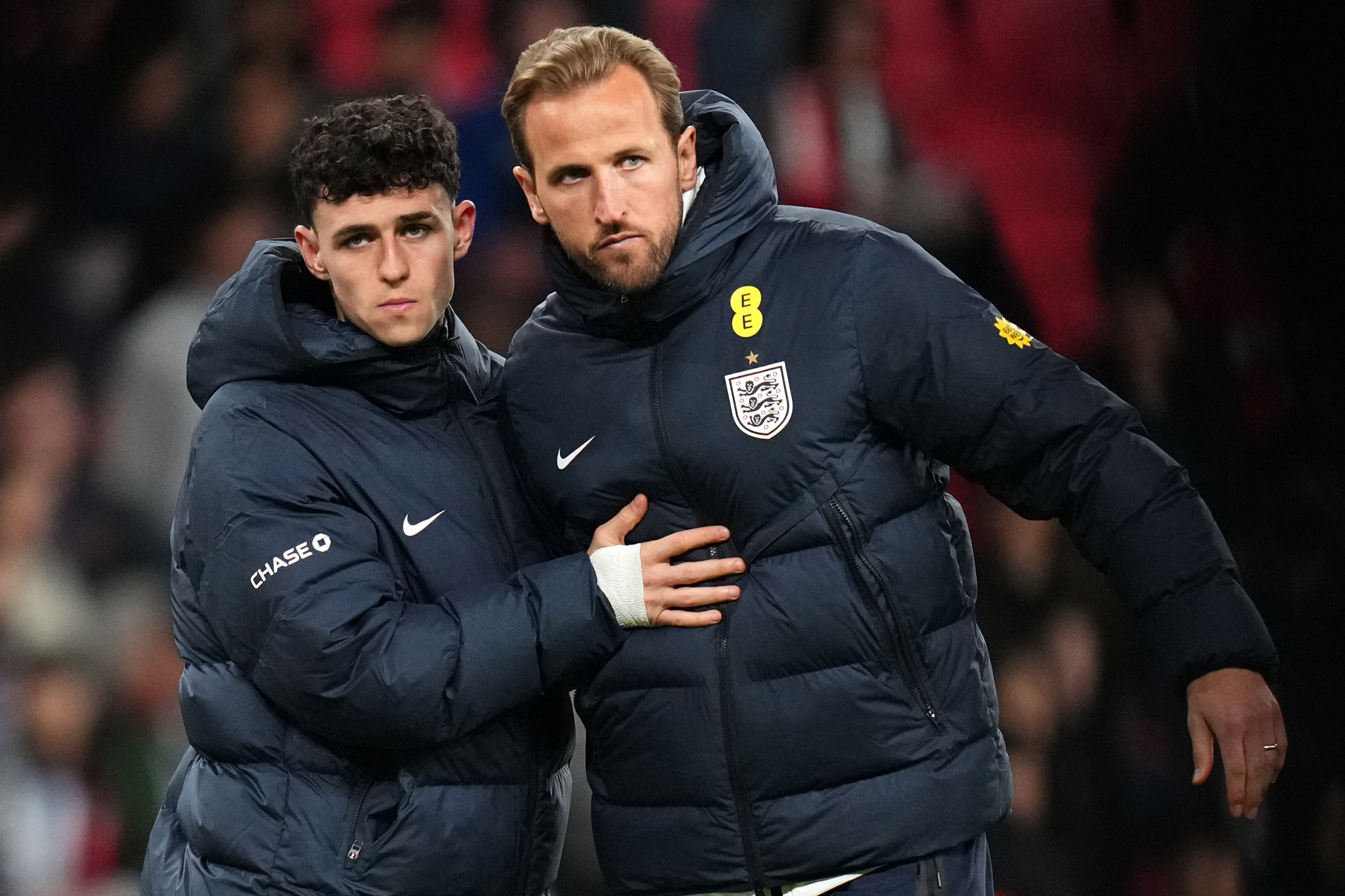 England's Phil Foden and Harry Kane reacts after their team lost the International friendly soccer match between England and Japan in London, Tuesday, March 31, 2026 . (AP Photo/Kirsty Wigglesworth)