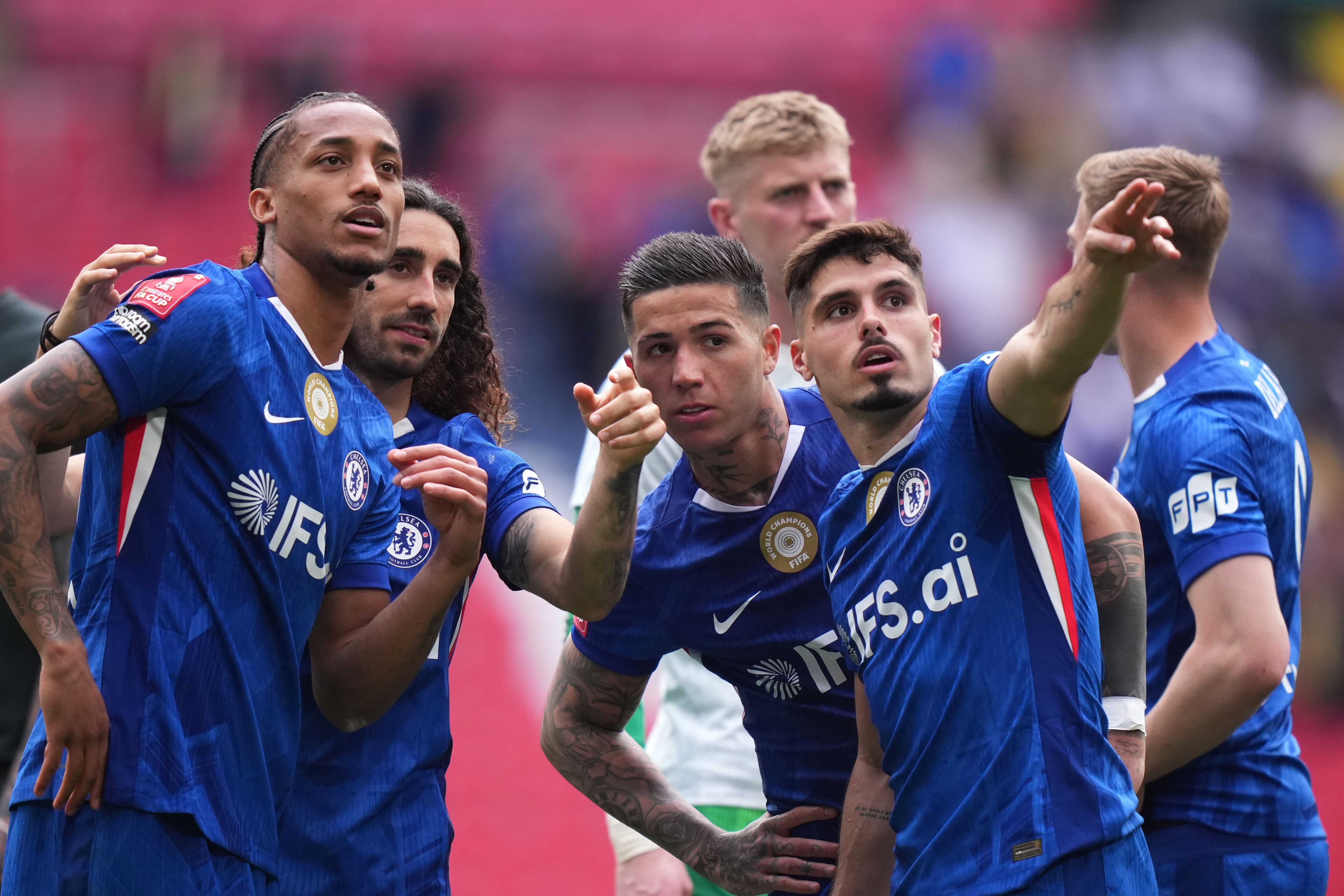 Chelsea's Joao Pedro, from left, Marc Cucurella, Enzo Fernandez and Pedro Neto speak at the the end of the FA Cup semifinal soccer match between Chelsea and Leeds in London, England, Sunday, April 26, 2026. (AP Photo/Alastair Grant)