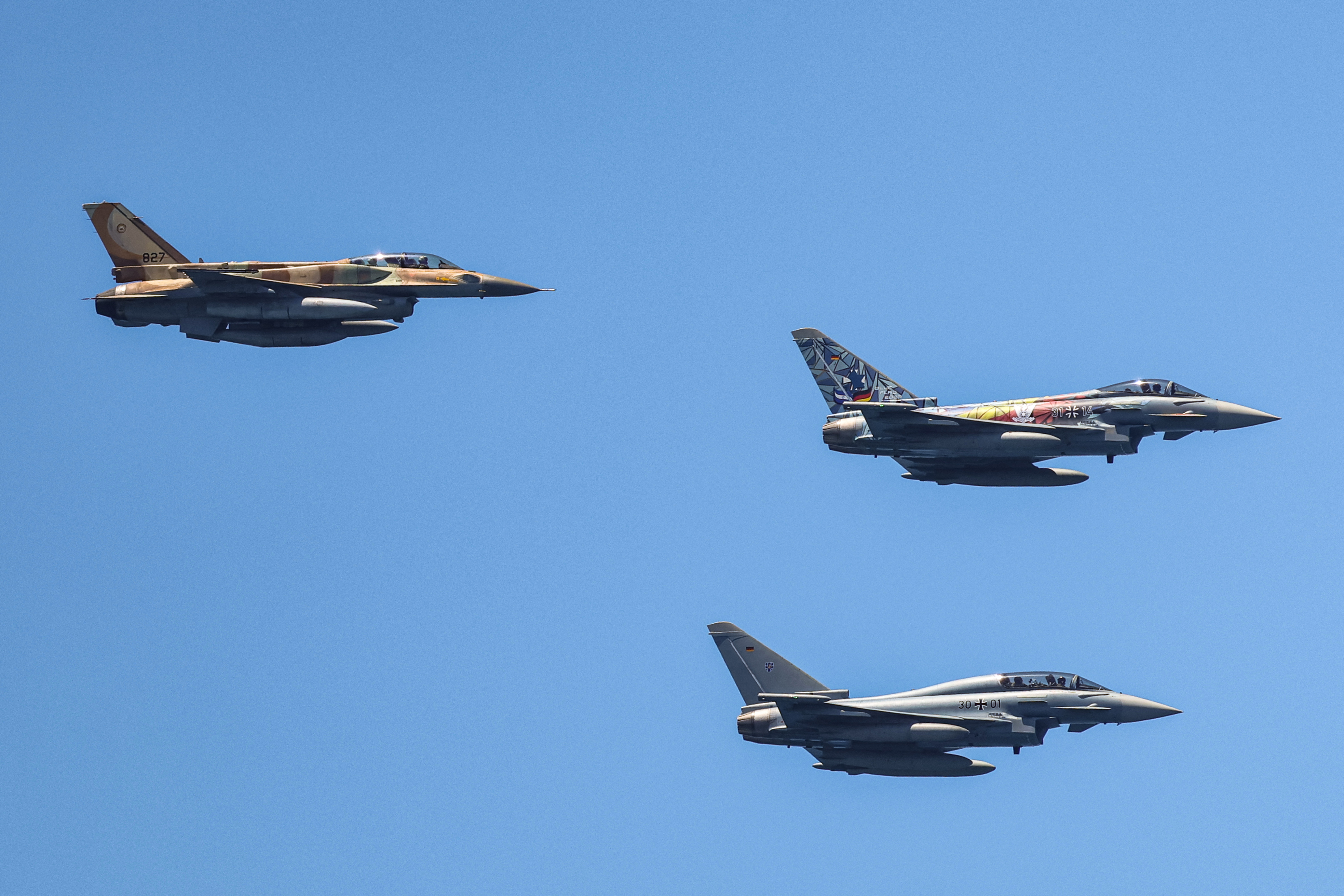 German Air Force Eurofighter Typhoon fighter aircraft (R) and Israeli Air Force F-16I Sufa. (Photo by JACK GUEZ / AFP)