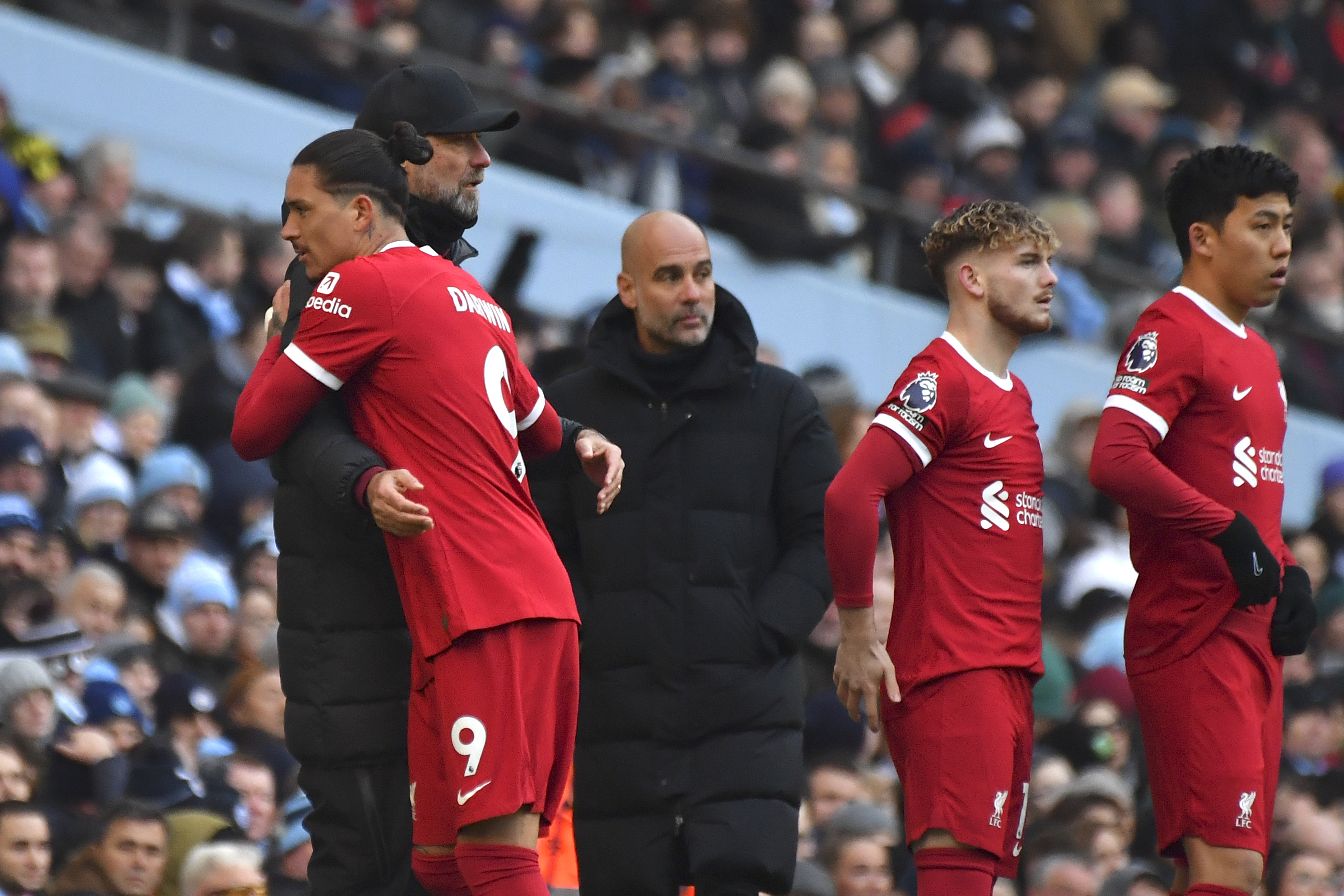 Liverpool's manager Jurgen Klopp hugs Liverpool's Darwin Nunez as he leaves the pitch for substitution during the English Premier League soccer match between Manchester City and Liverpool at Etihad stadium in Manchester, England, Saturday, Nov. 25, 2023.