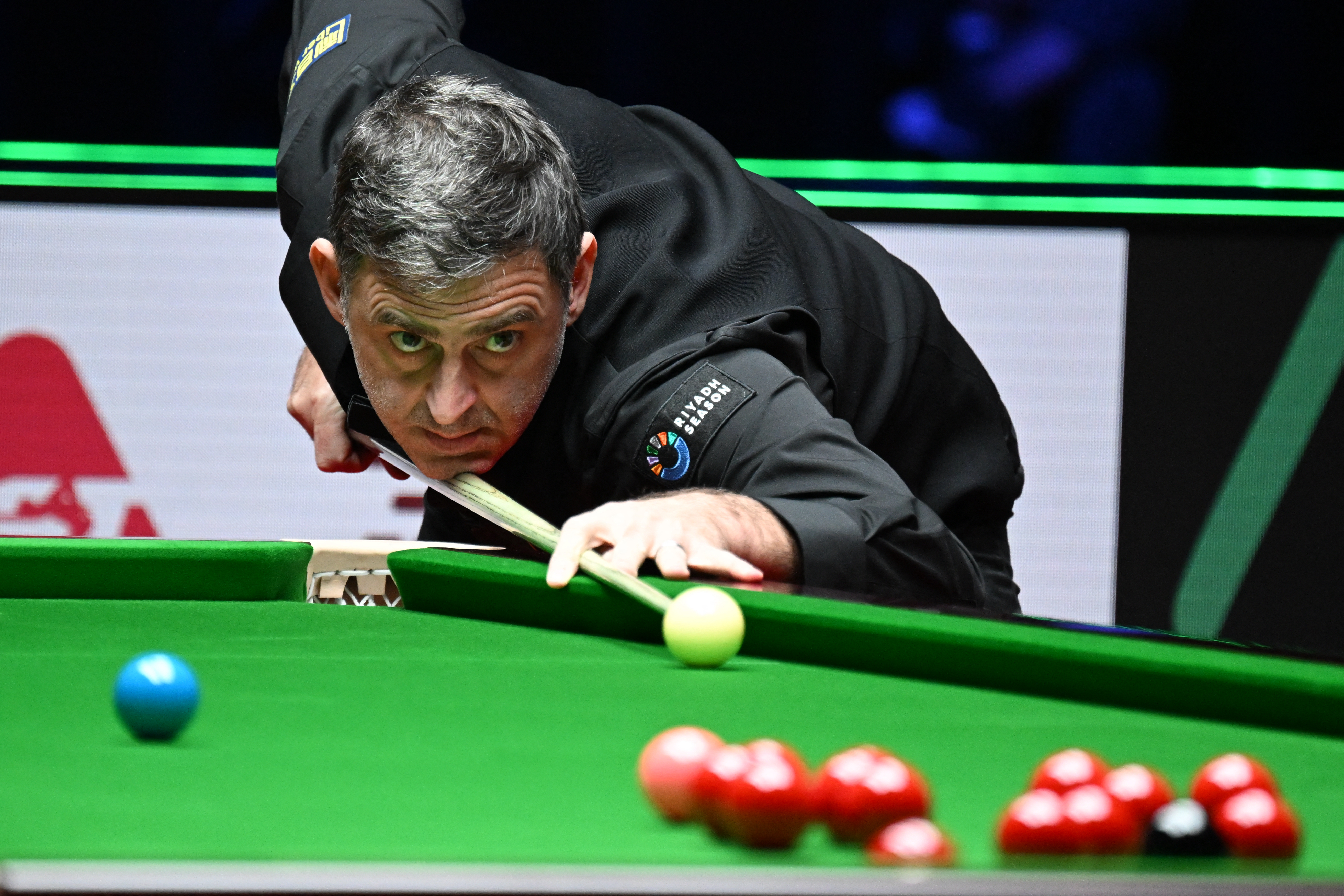 Britain's Ronnie O'Sullivan plays a shot against against compatriot Joe O'Connor in round 1 of the Snooker World Grand Prix 2026 in Hong Kong on February 4, 2026. (Photo by Peter PARKS / AFP)