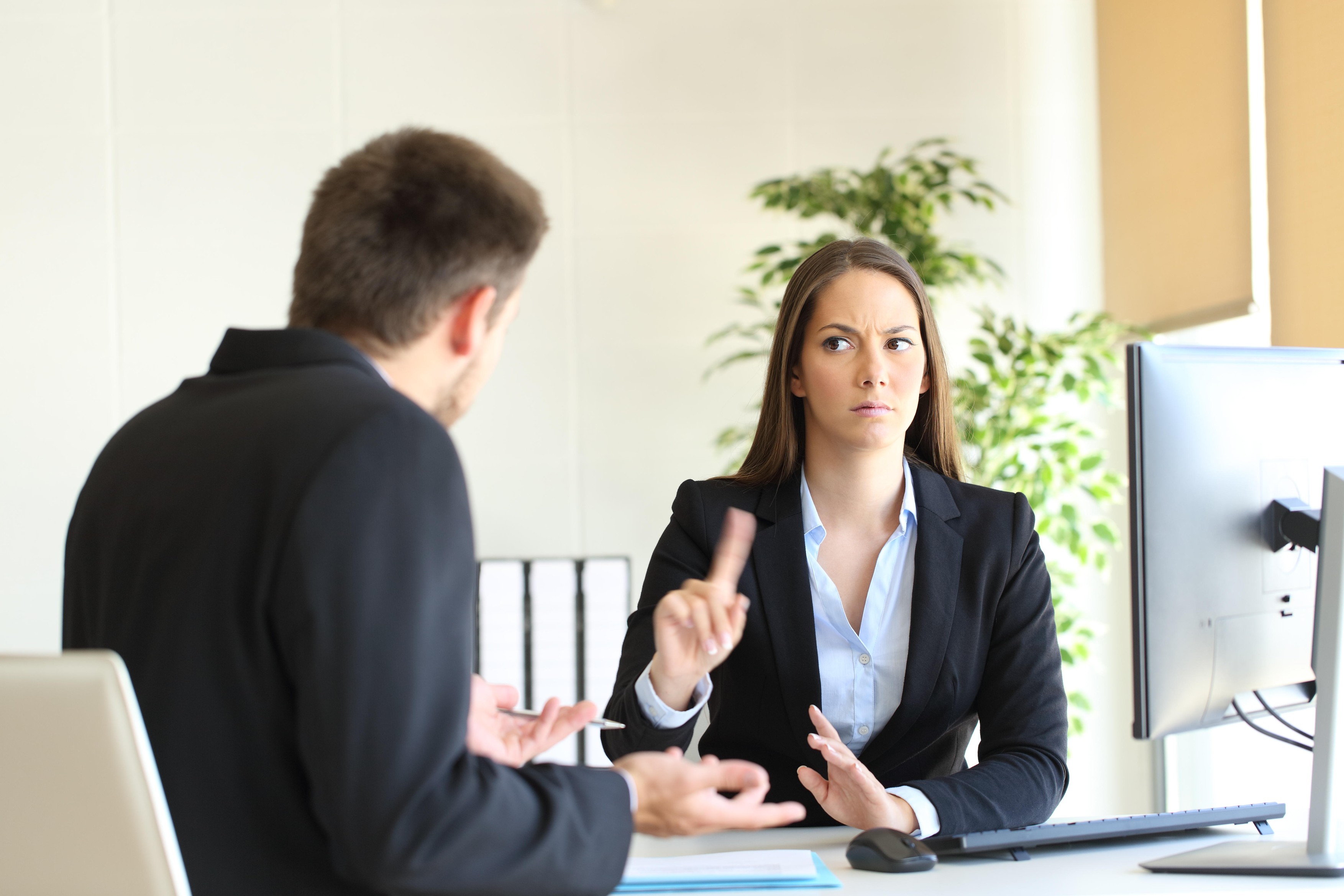 Boss denying something saying no with a finger