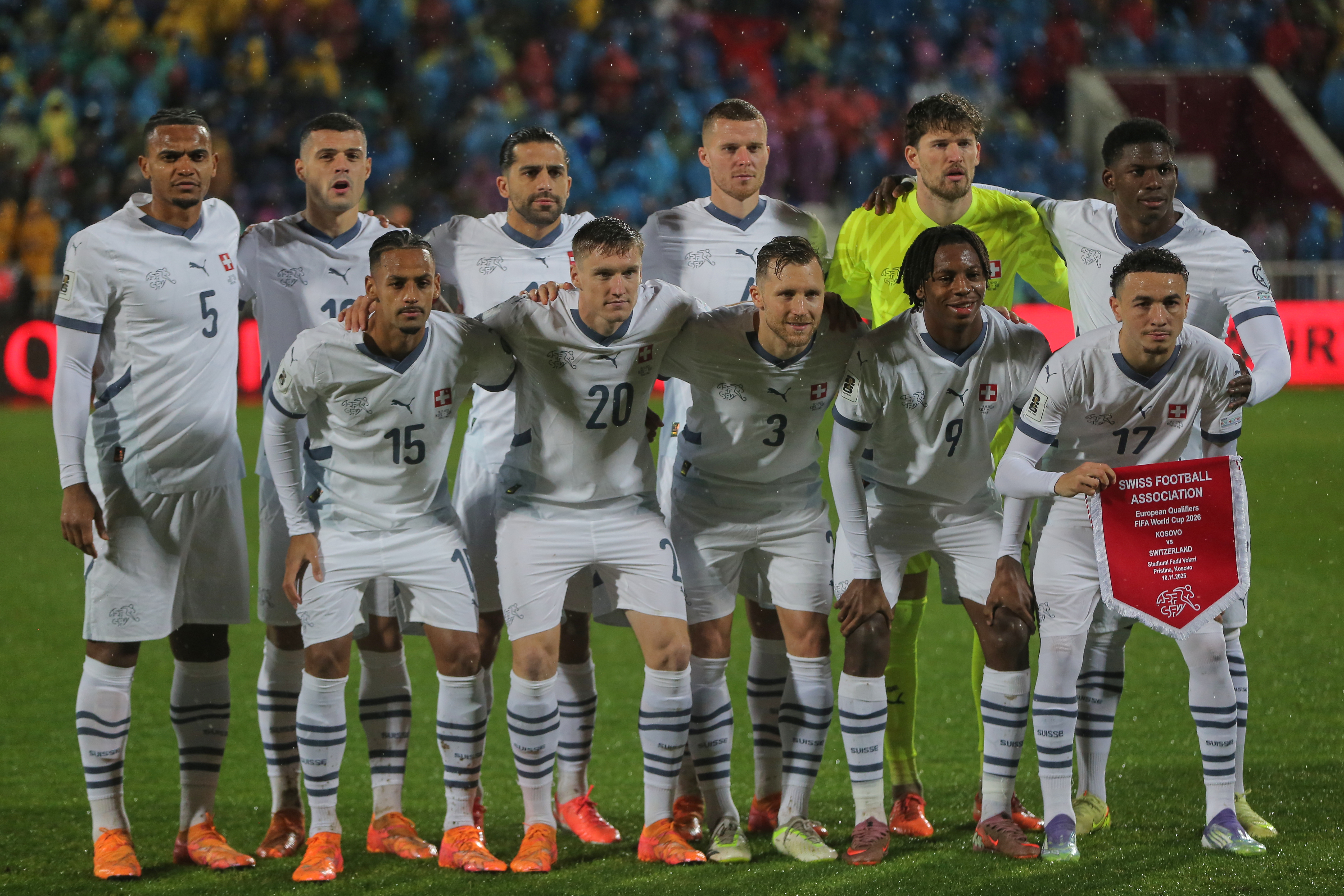 Switzerland starting players pose for a team photo at the beginning of the 2026 World Cup Group B qualifying soccer match between Kosovo and Switzerland in Pristina, Kosovo, Tuesday, Nov. 18, 2025. (AP Photo/Visar Kryeziu)