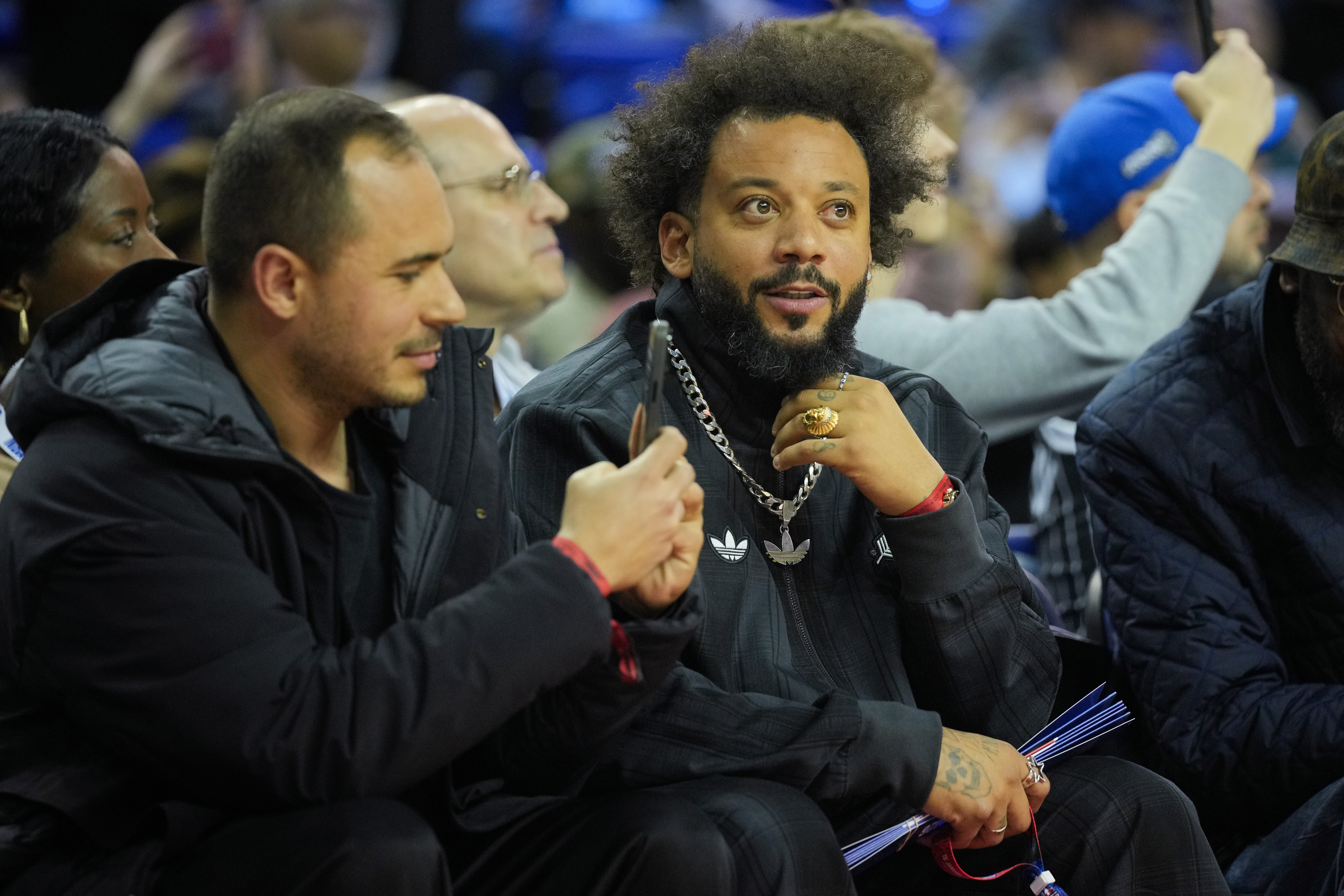 Former Fluminense and Real Madrid soccer player Marcelo Vieira, right, attends an NBA basketball game between the Memphis Grizzlies and the Orlando Magic, Sunday, Jan. 18, 2026, in London. (AP Photo/Kin Cheung)