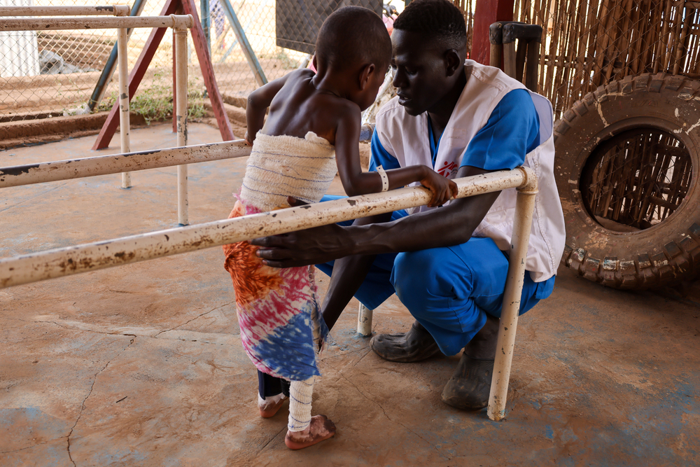 MSF Physiotherapist helps a young patient suffering from burns to walk again.The physiotherapy unit located in the MSF supported hospital in Aweil is focused on helping children.