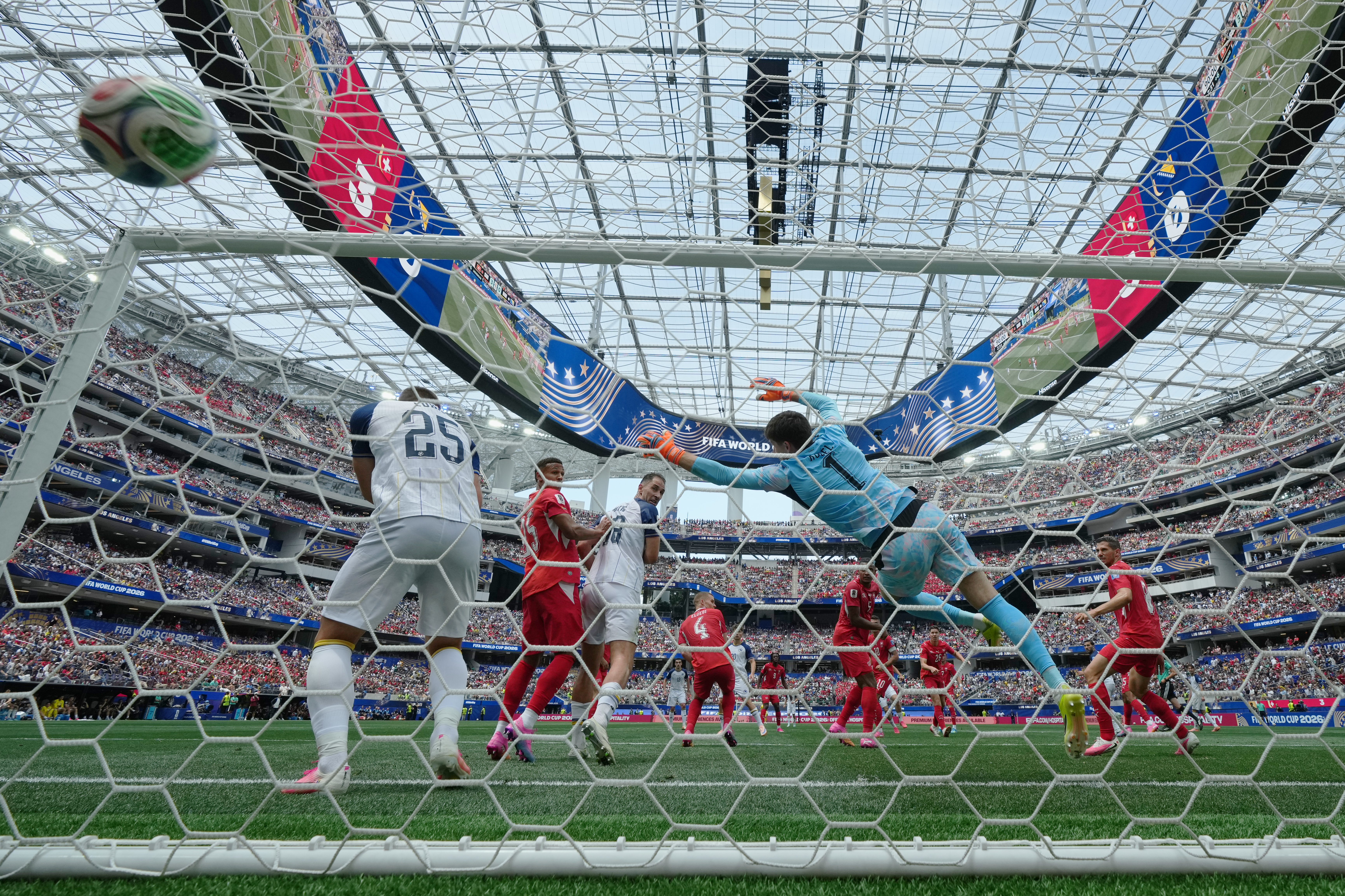 Switzerland goalkeeper Gregor Kobel (1) is beaten on shot for a goal by Bosnia's Ermin Mahmic (26) during the World Cup Group B soccer match between Switzerland and Bosnia in Inglewood, Calif., near Los Angeles, Thursday, June 18, 2026. (AP Photo/Andre Pe