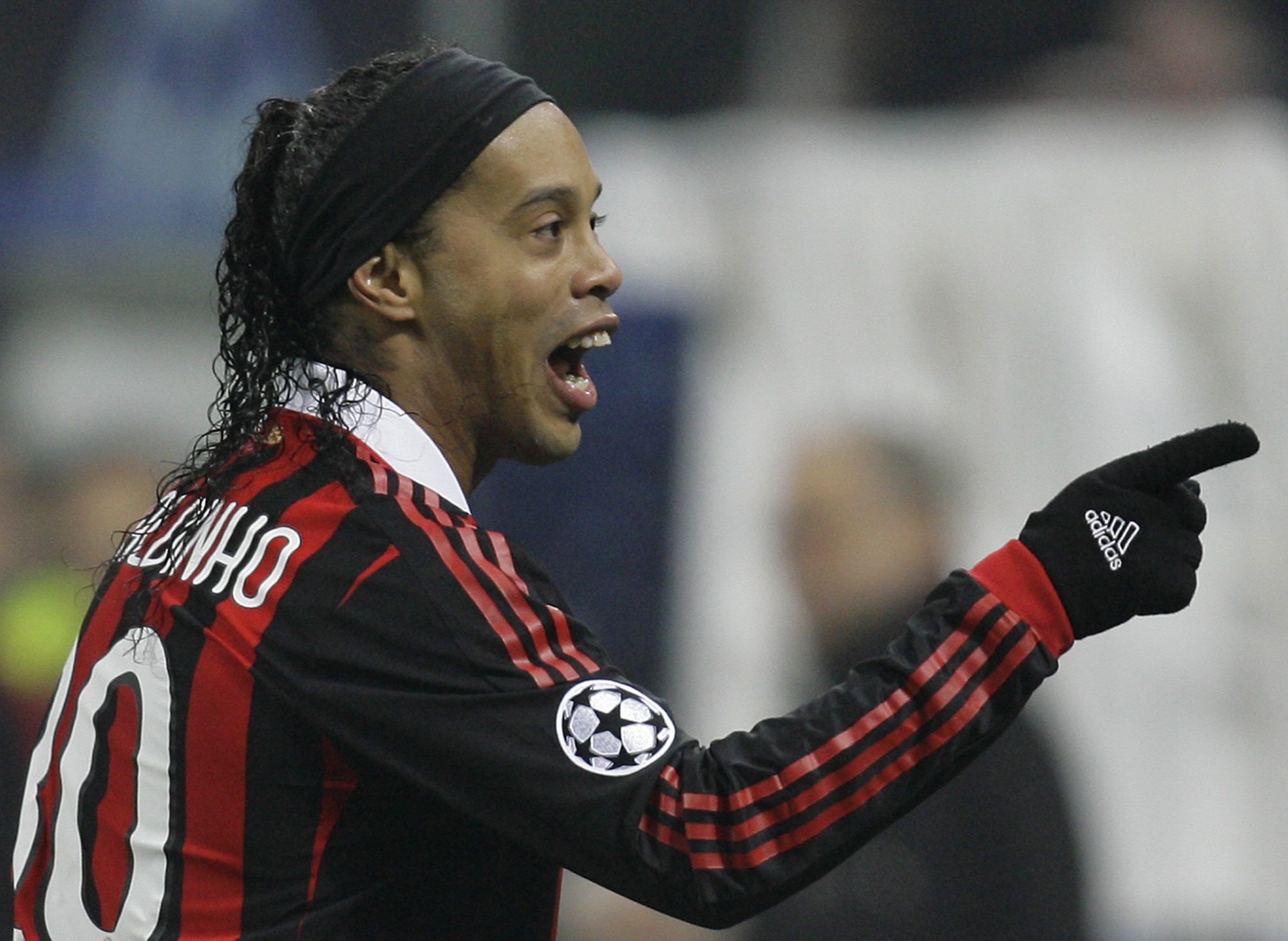 AC Milan Brazilian forward Ronaldinho celebrates after scoring during a Champions League, round of 16, first leg soccer match between AC Milan and Manchester United at the San Siro stadium in Milan, Italy, Tuesday, Feb. 16, 2010. (AP Photo/Alberto Pellasc