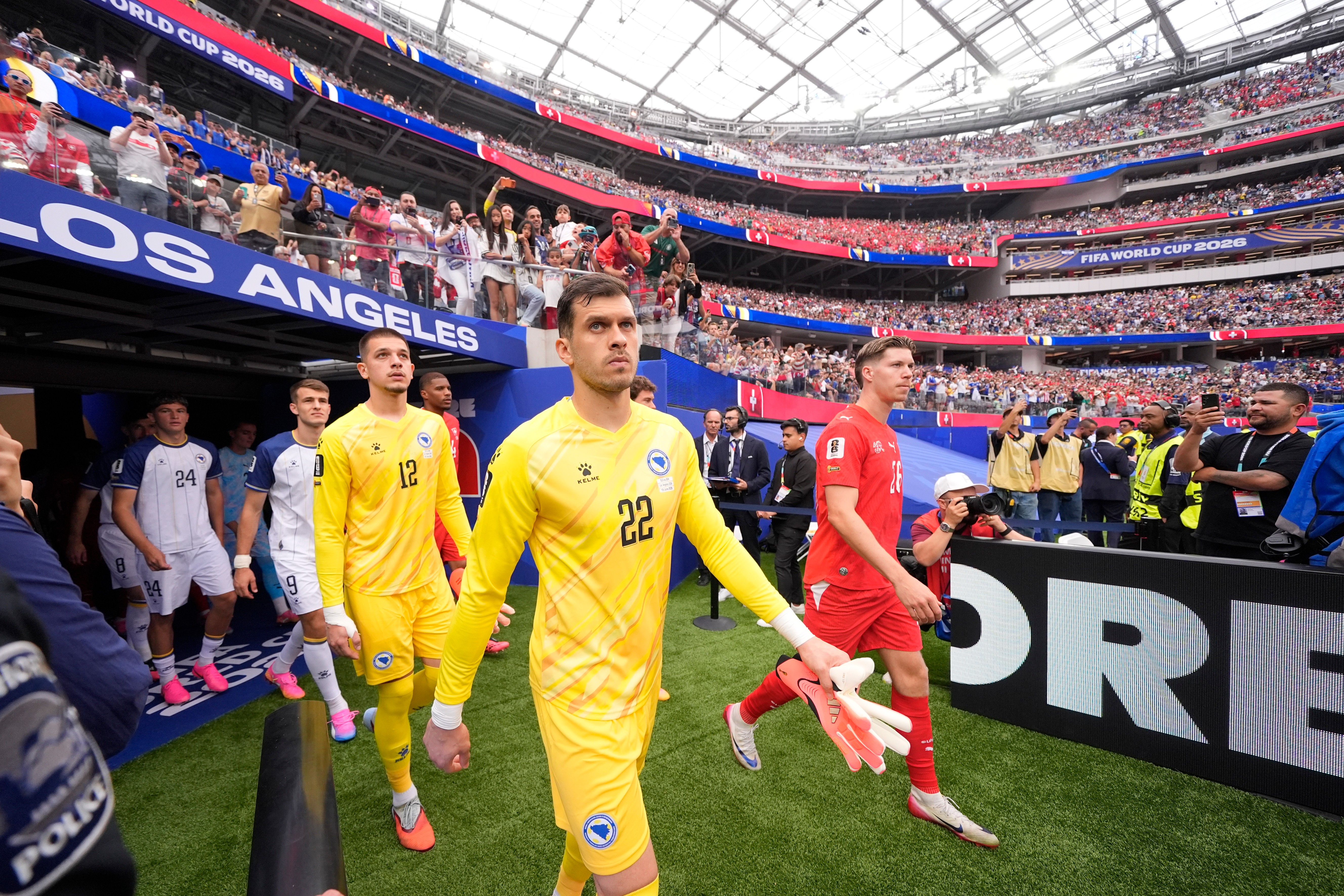 Bosnia goalkeeper Martin Zlomislic and teammates enter the pitch before the World Cup Group B soccer match against Switzerland in Inglewood, Calif., near Los Angeles, Thursday, June 18, 2026. (AP Photo/Mark J. Terrill)