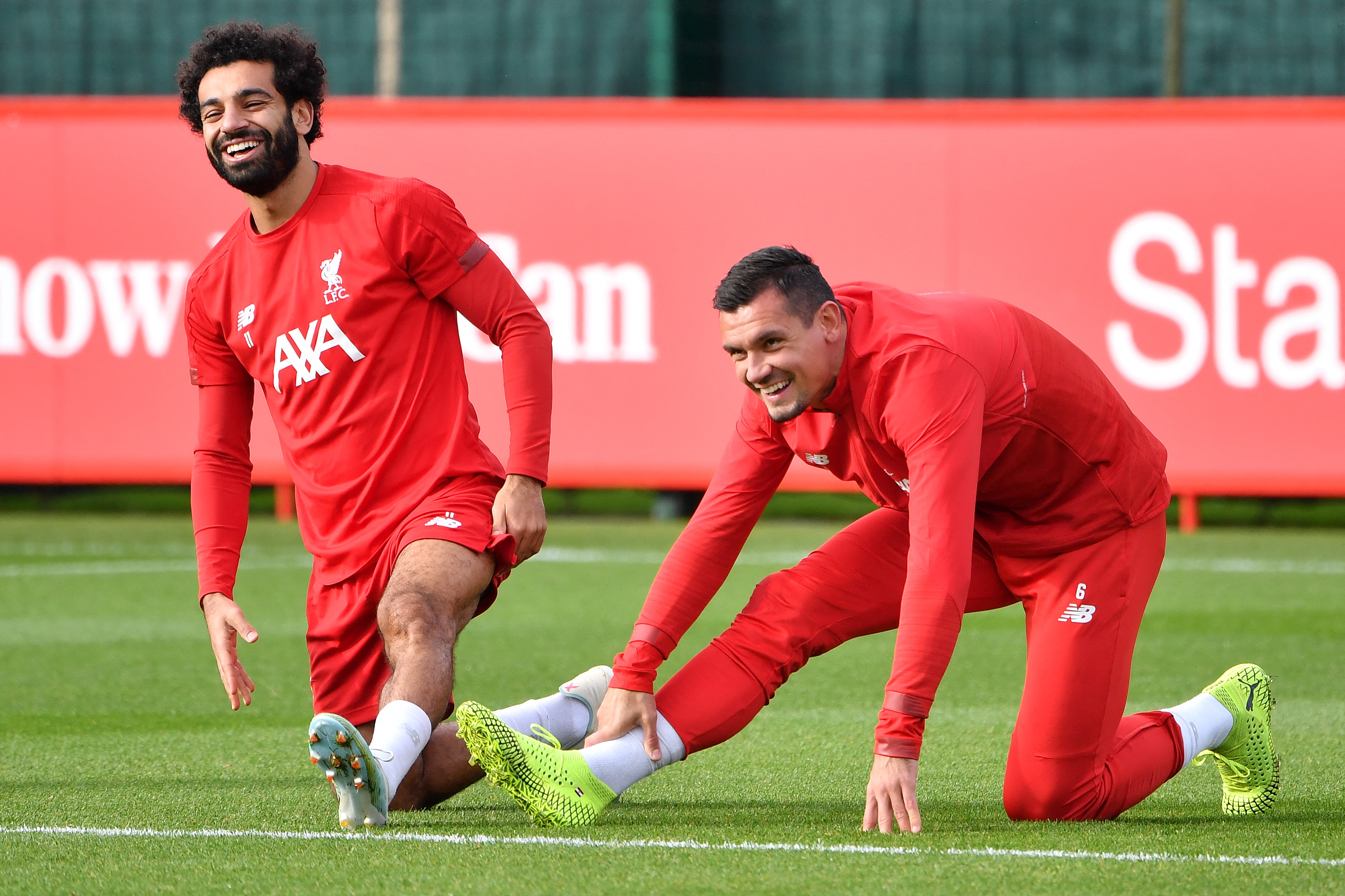 Liverpool's Egyptian midfielder Mohamed Salah (L) and Liverpool's Croatian defender