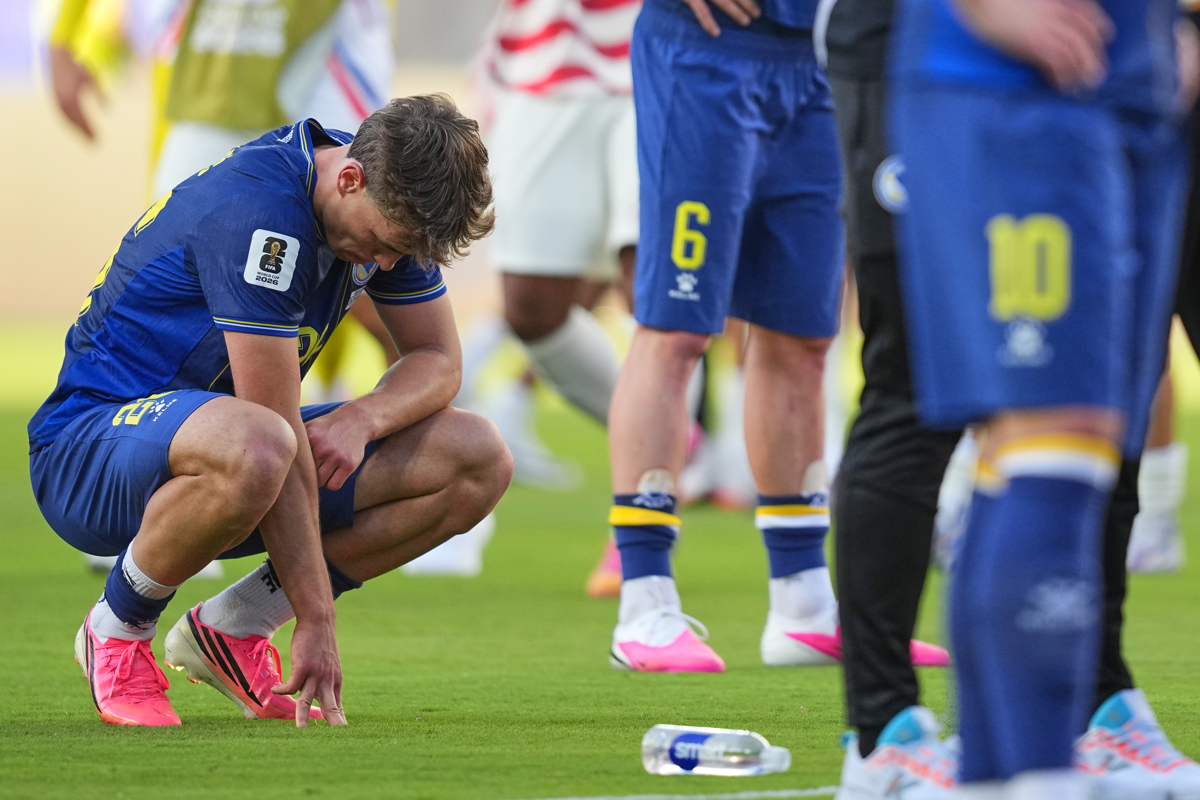 Bosnia's Ermin Mahmic (26) reacts following the World Cup round of 32 soccer match between the United States and Bosnia in Santa Clara, Calif., near San Francisco, Wednesday, July 1, 2026. (AP Photo/Julio Cortez)
