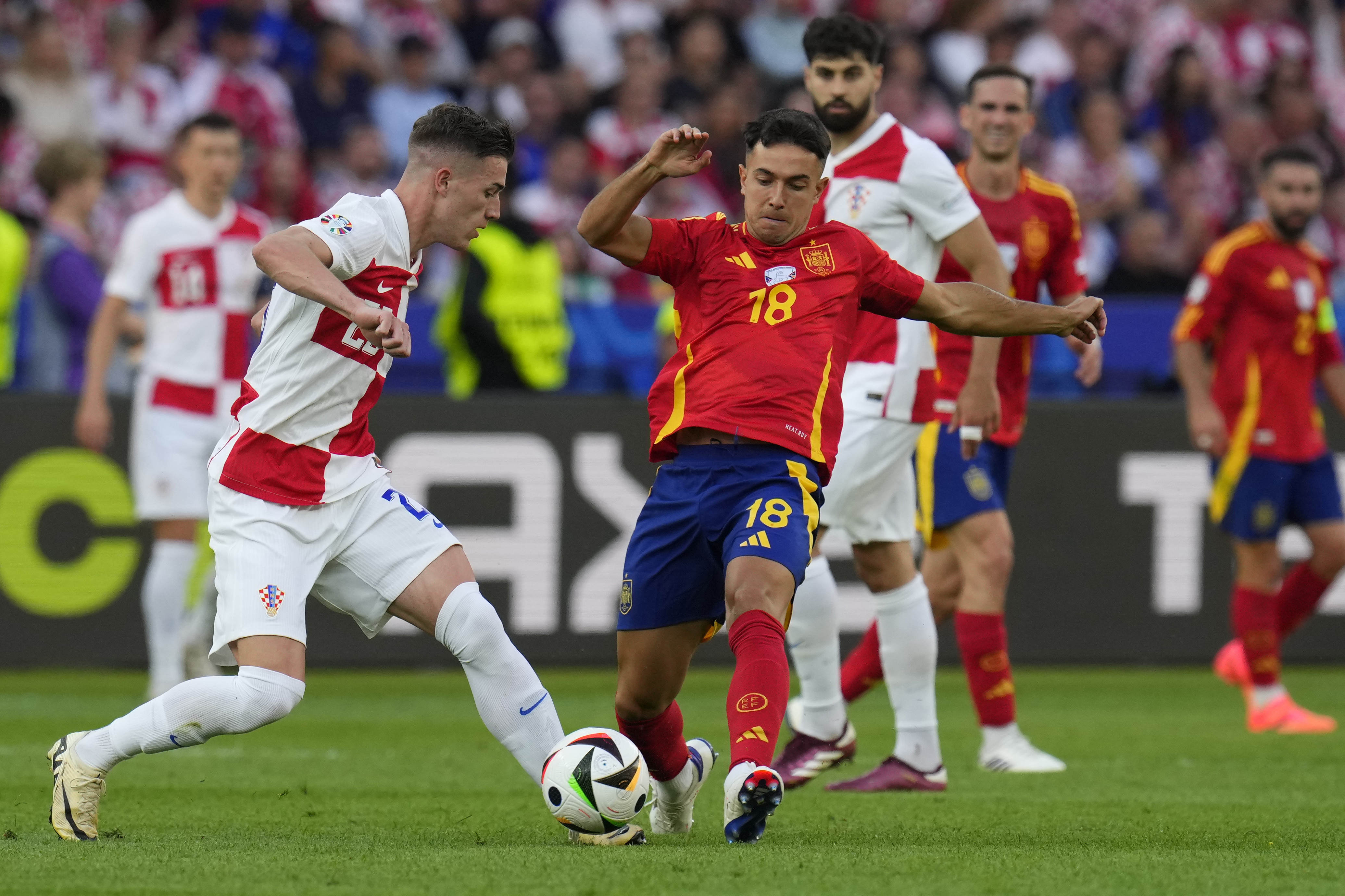 Spain's Martin Zubimendi, right, fights for the ball with Croatia's Luka Sucic during a Group B match between Spain and Croatia at the Euro 2024 soccer tournament in Berlin, Germany, Saturday, June 15, 2024. Spain defeated Croatia 3-0. (AP Photo/Manu Fern