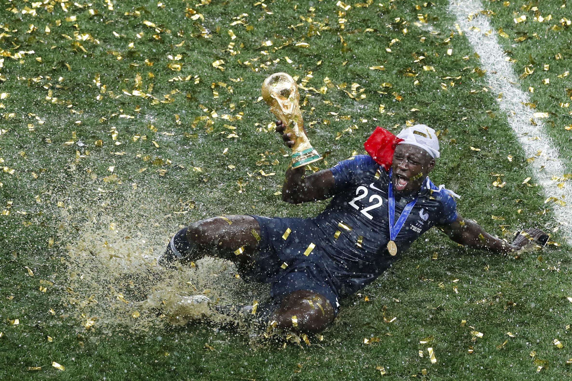 France's Benjamin Mendy celebrates with the trophy after his team won the final match against Croatia at the 2018 soccer World Cup in the Luzhniki Stadium in Moscow, Russia, on July 15, 2018. (AP Photo/Rebecca Blackwell)