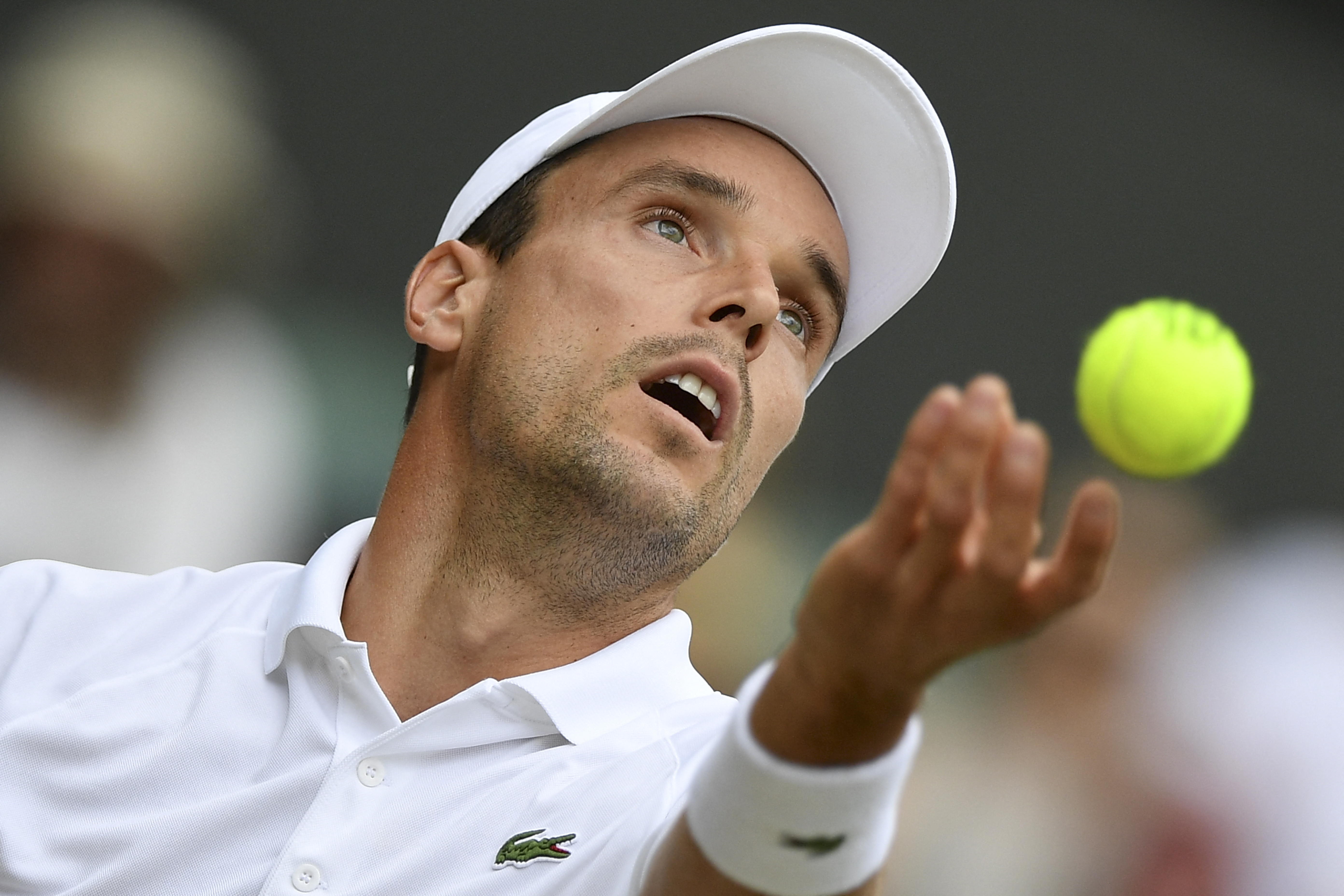 Spain's Roberto Bautista Agut serves against Serbia's Novak Djokovic during their men'