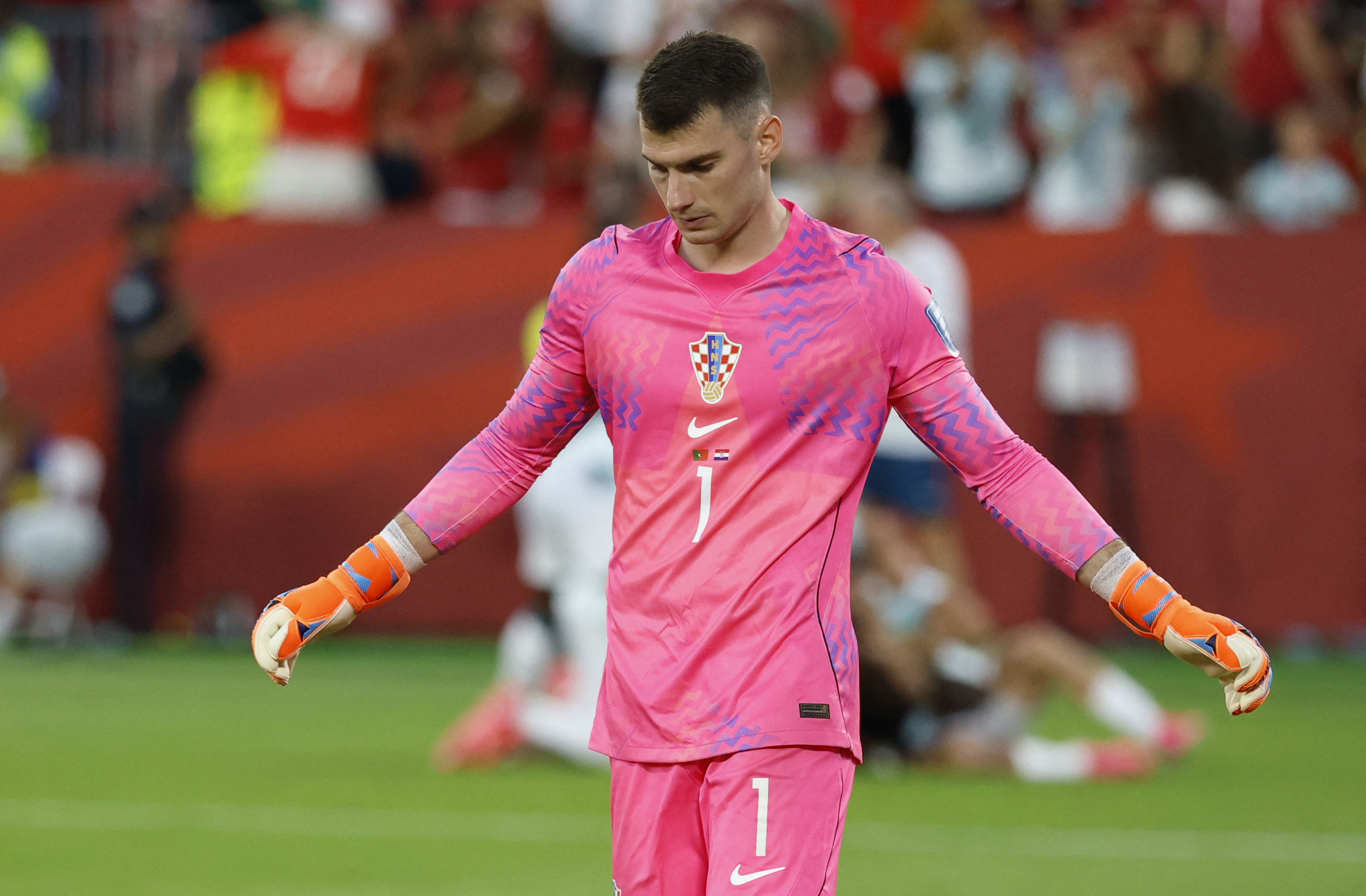 Croatia's goalkeeper #01 Dominik Livakovic reacts after conceding Portugal's second goal during the 2026 World Cup round of 32 football match between Portugal and Croatia at the Toronto Stadium in Toronto on July 2, 2026. (Photo by Kamil Krzaczynski / AF