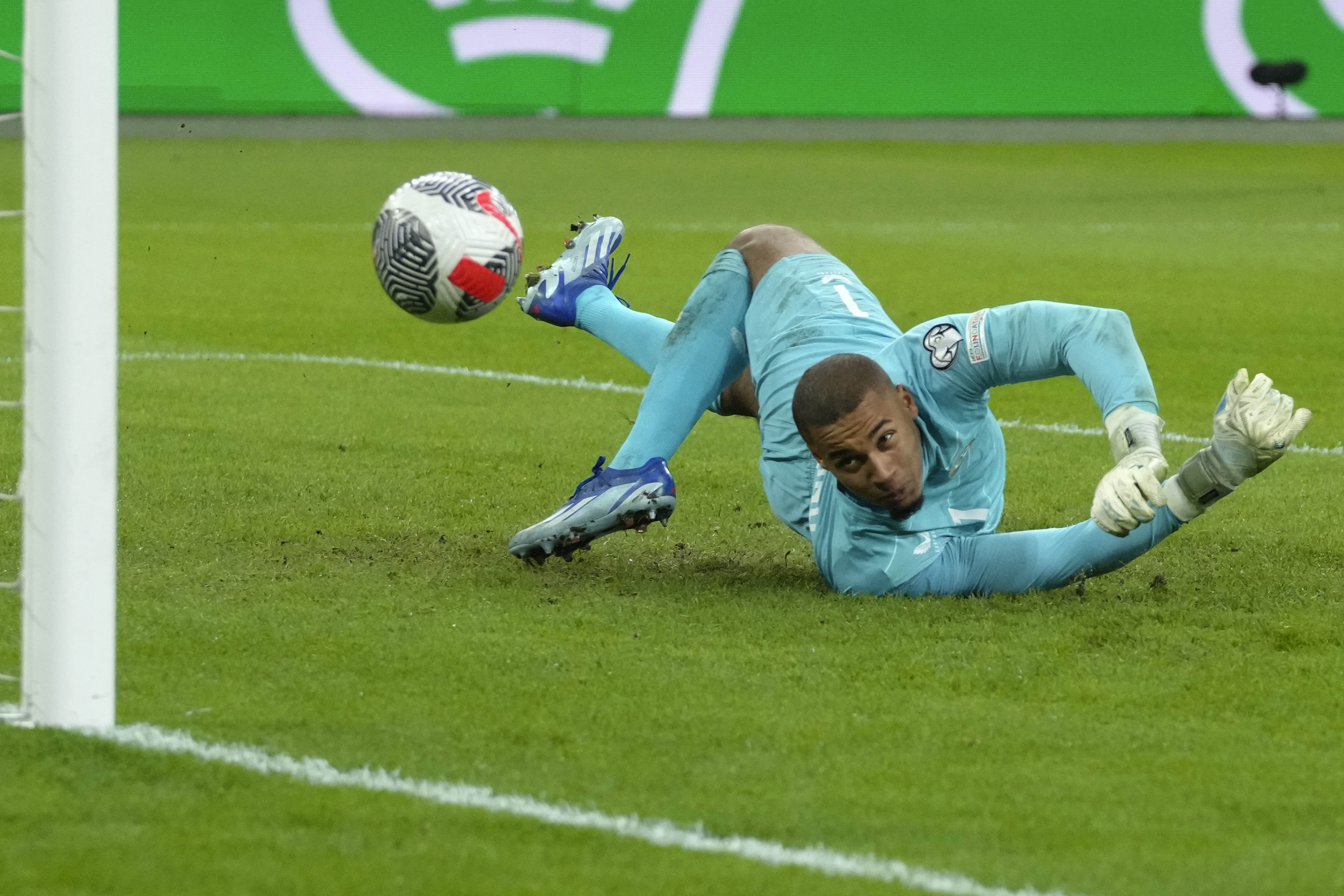 Ireland's goalkeeper Gavin Bazunu watches the ball hit the post after a shot on goal during the Euro 2024 group B qualifying soccer match between the Netherlands and Ireland at the Johan Cruyff ArenA stadium in Amsterdam, Netherlands, Saturday, Nov. 18, 2