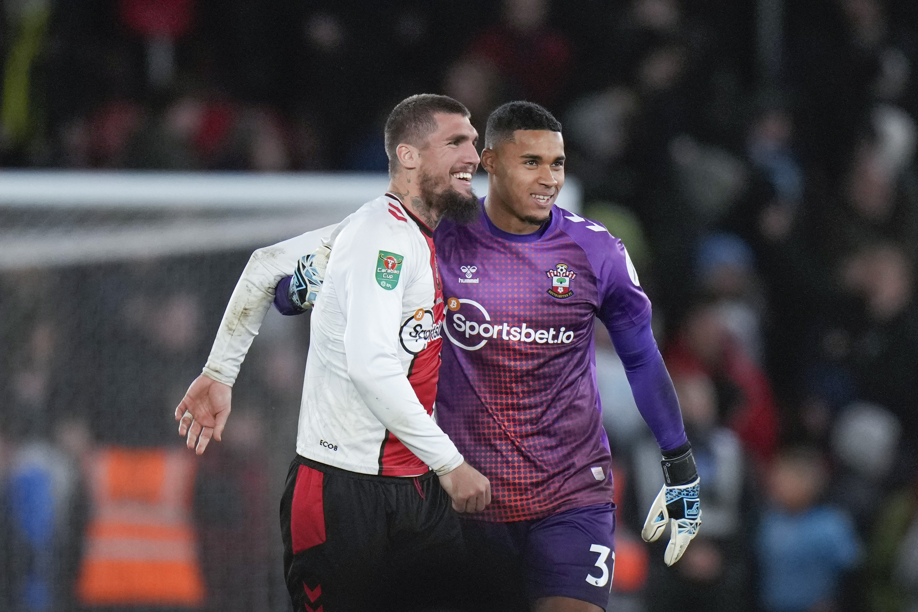 Southampton's Lyanco, left, and goalkeeper Gavin Bazunu celebrate at the end of the English League Cup quarter final soccer match between Southampton and Manchester City at St Mary's stadium in Southampton, England, Wednesday, Jan. 11, 2023. Southampton w