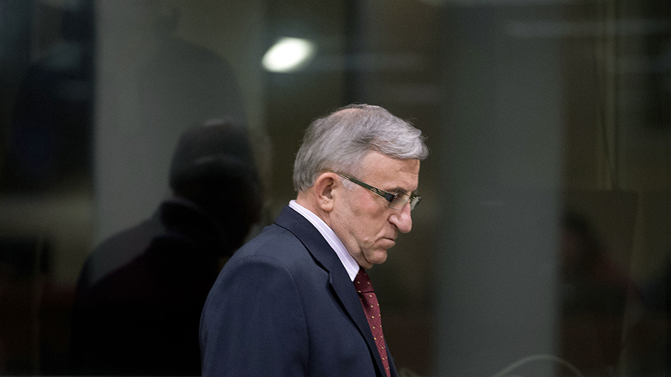 Vladimir Lazarevic enters the courtroom of the Yugoslav war crimes tribunal in The Hague